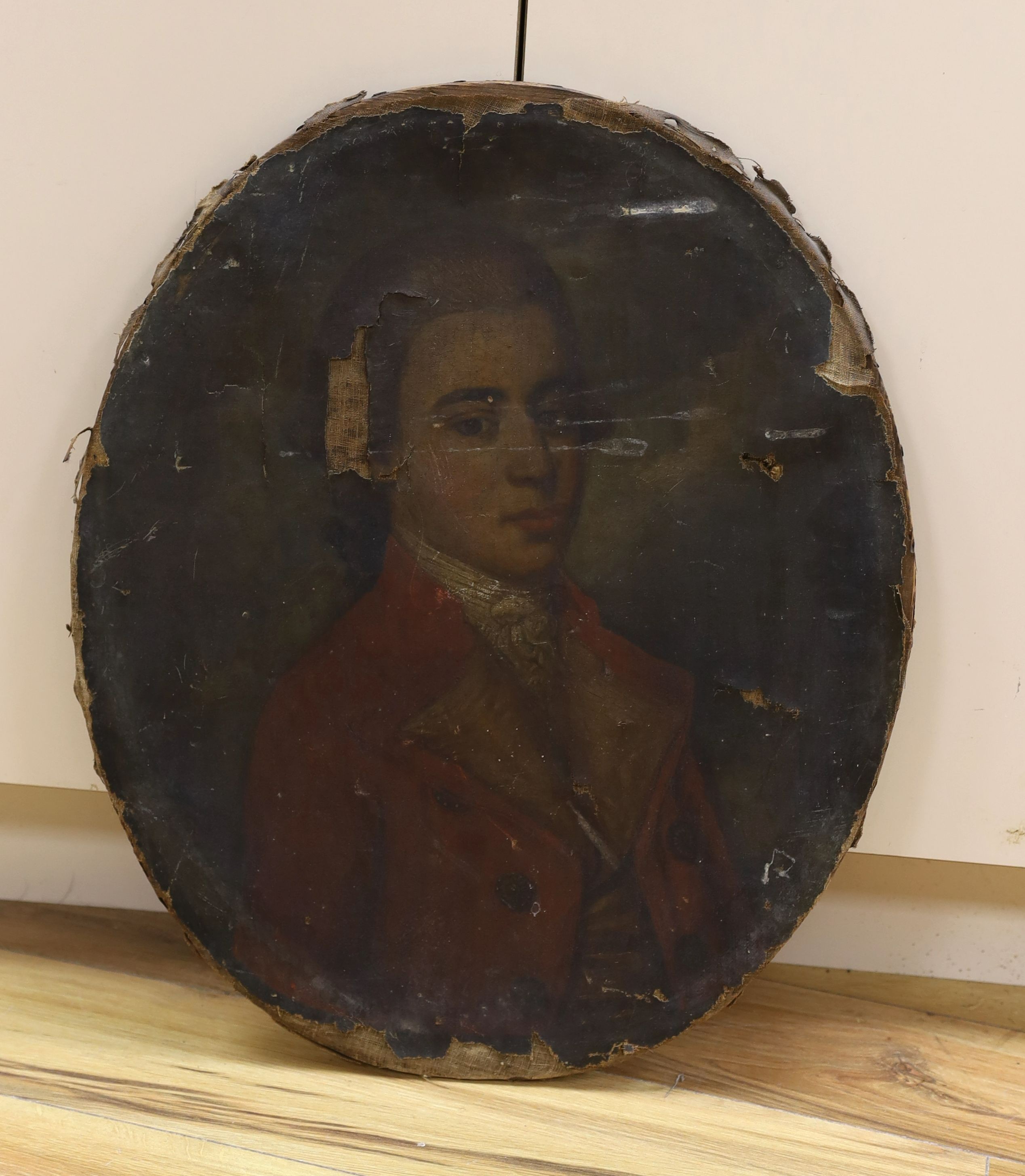 Late 18th century English School, oil on canvas, Portrait of a gentleman wearing a red coat, oval, 65 x 54cm, unframed (a.f.)